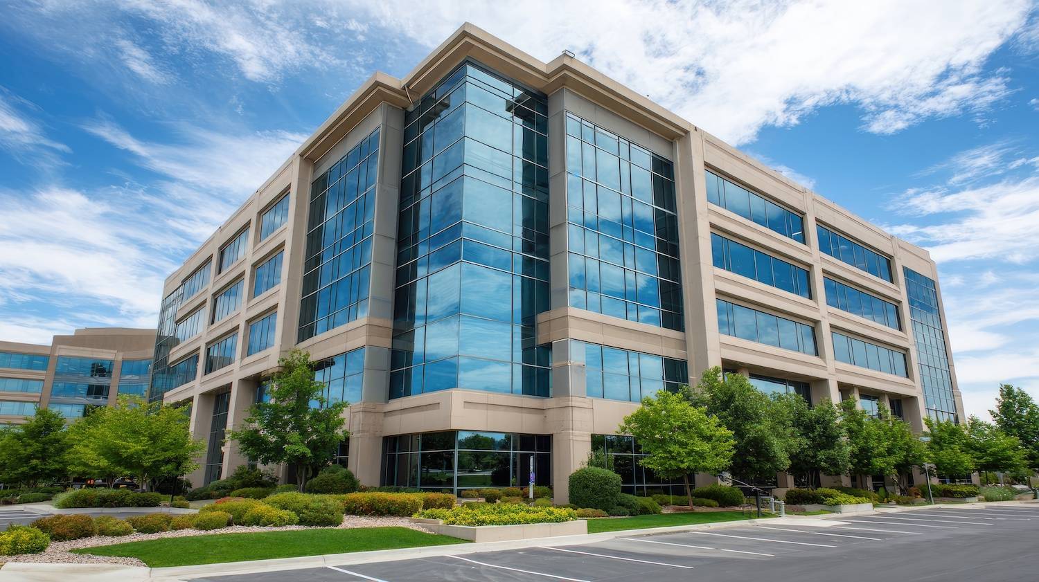 Landscaped grounds outside a modern corporate office building