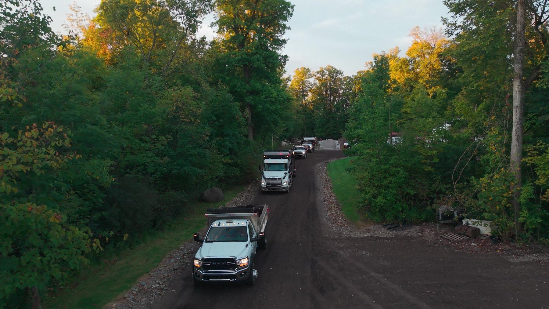 Aerial view of Exscape Group trucks heading out of the yard