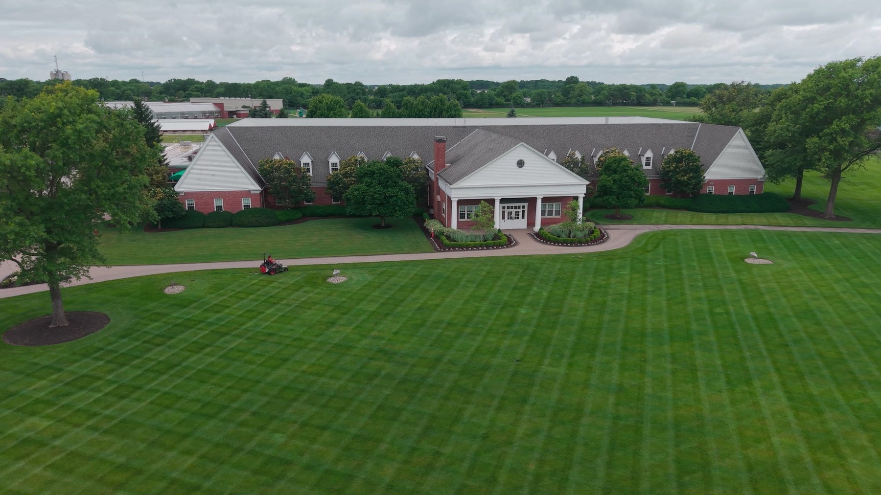 Aerial view of a striped lawn at a corporate headquarters maintained by Exscape Group