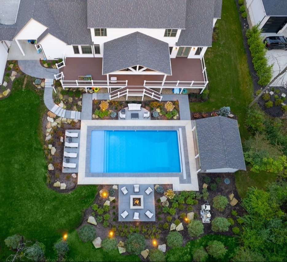 Aerial view of modern backyard pool design and landscape architecture in Painesville, Ohio