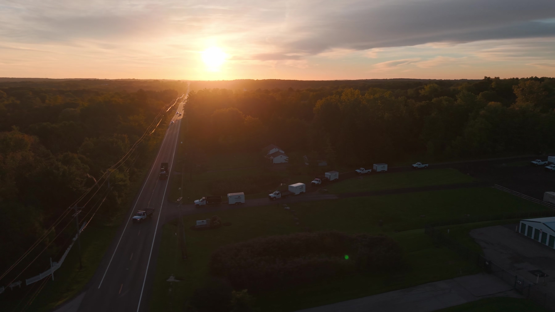 Aerial view of the sun setting over the Exscape Group property