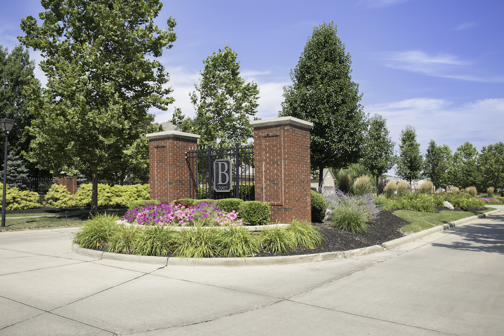Landscaped commercial entrance with seasonal plantings