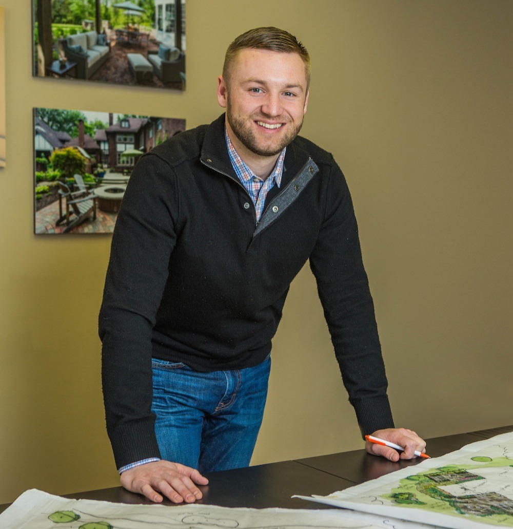 Bill Dysert, landscape industry leader at Exscape Group, reviewing landscape design plans in Novelty, Ohio