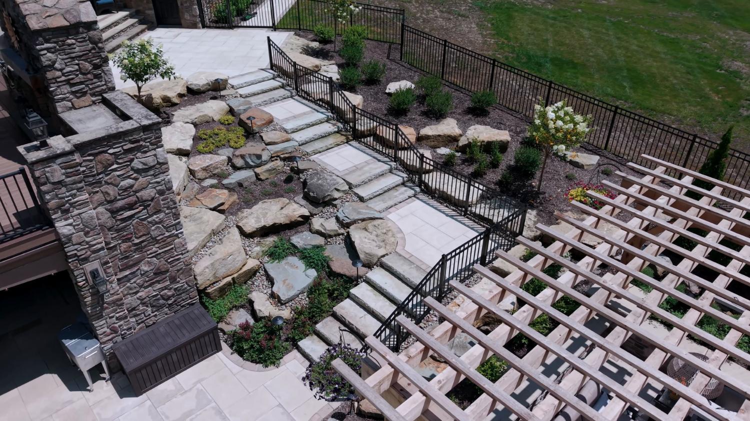 Boulder and stone details creating a natural backyard escape in Northeast Ohio