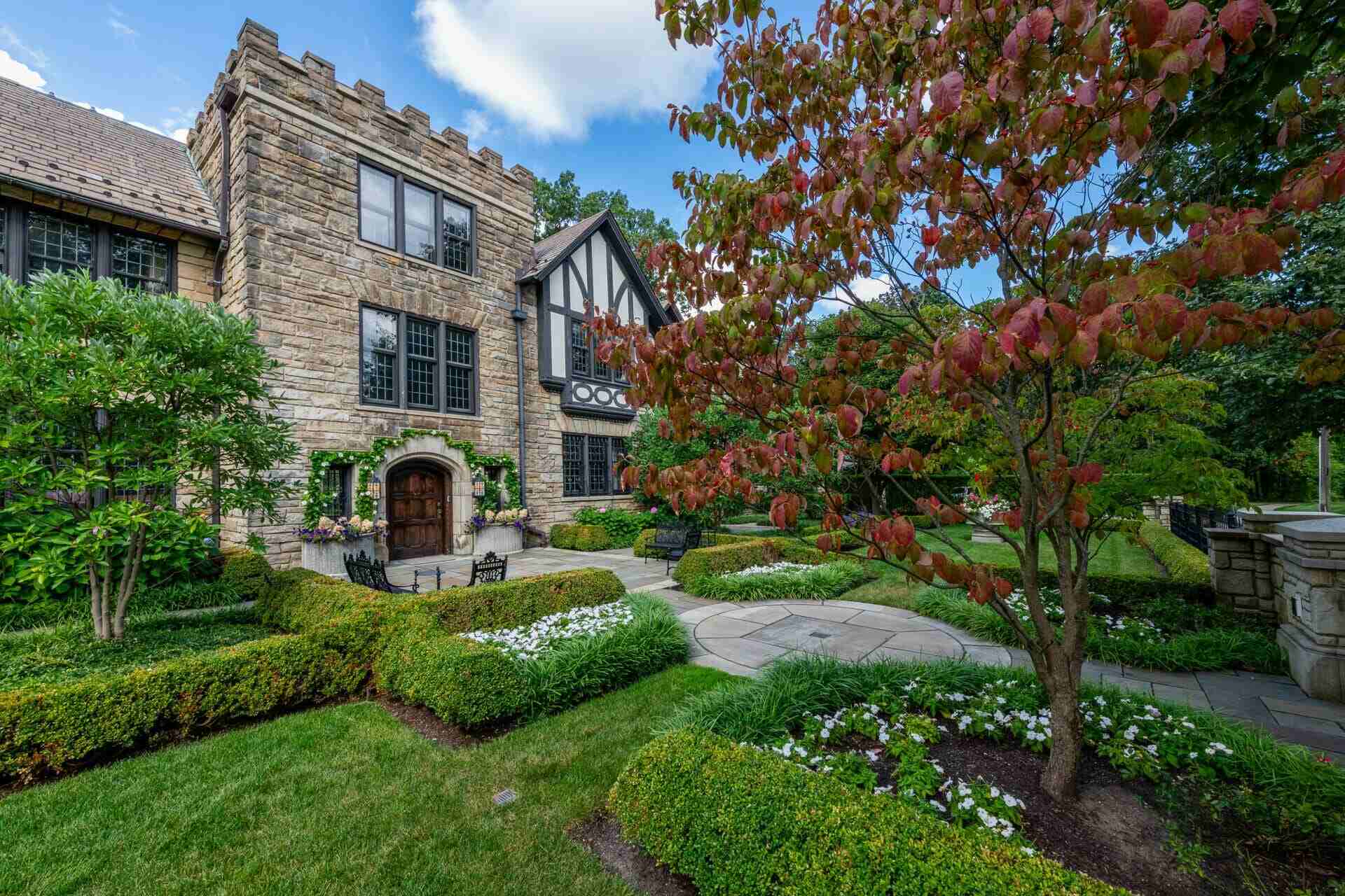 Charming garden pathway lined with vibrant plantings at a historic home in Novelty, OH