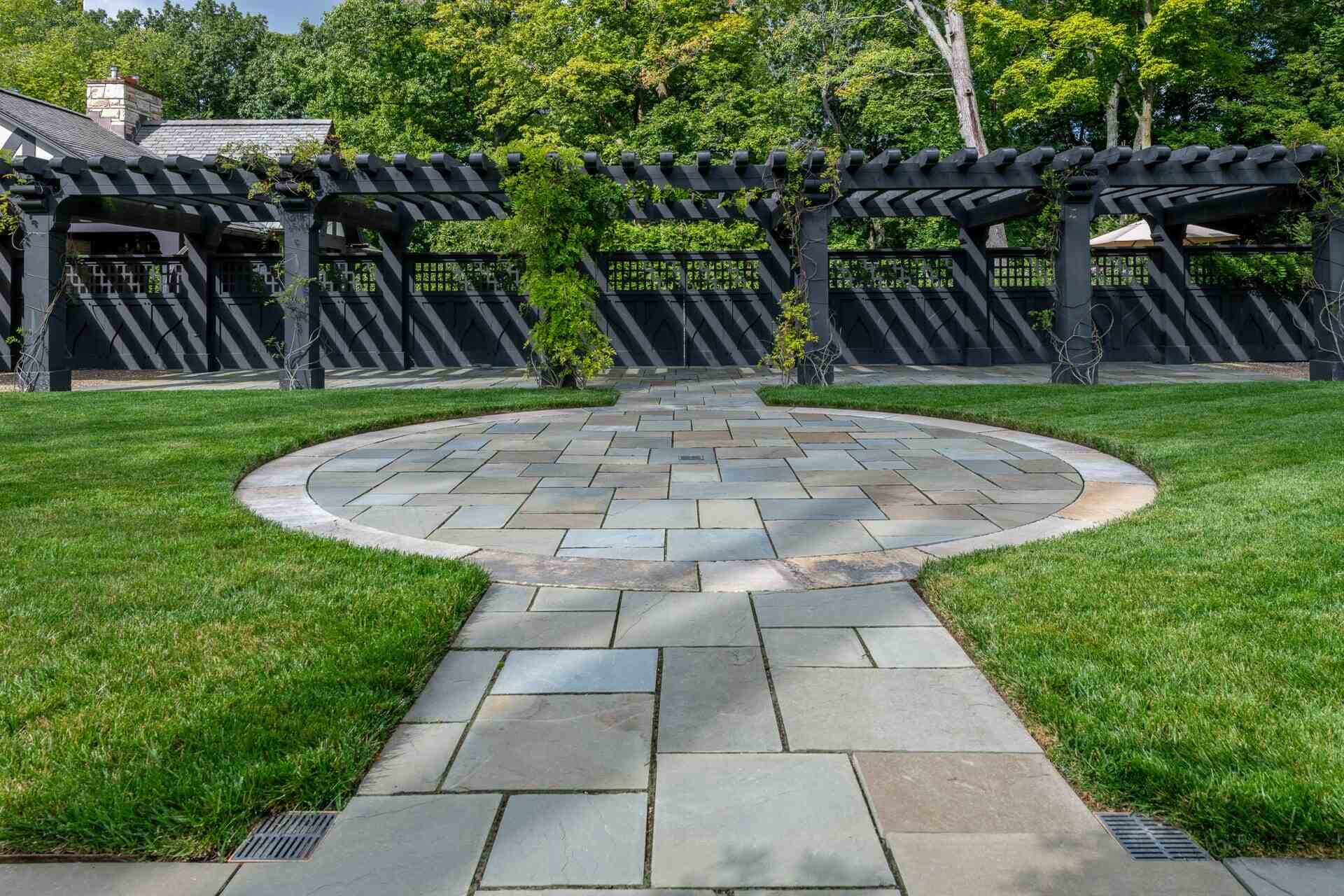 Cozy stone courtyard surrounded by greenery for relaxation in a private estate in Cleveland, OH