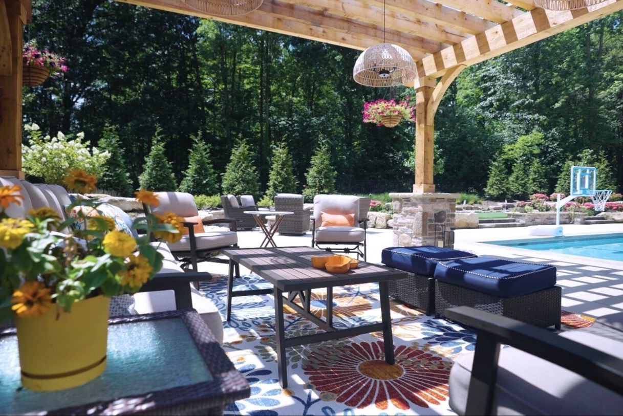 Custom backyard patio and poolside landscape design in Novelty, Ohio
