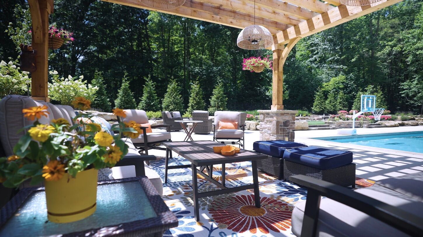 Custom backyard patio and poolside landscape design in Novelty, Ohio