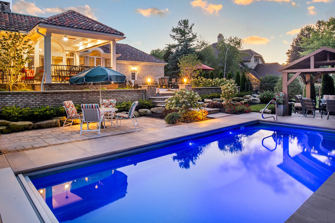 Custom pool and pergola surrounded by professional landscape design in Columbus, Ohio
