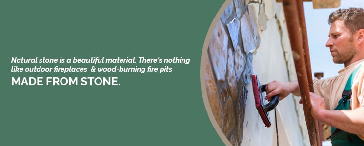 Viewed looking up at a worker applying a covering to a stone wall cropped in a circle with text to the left reading "Natural stone is a beautiful material. There’s nothing like outdoor fireplaces and wood-burning fire pits made from stone."