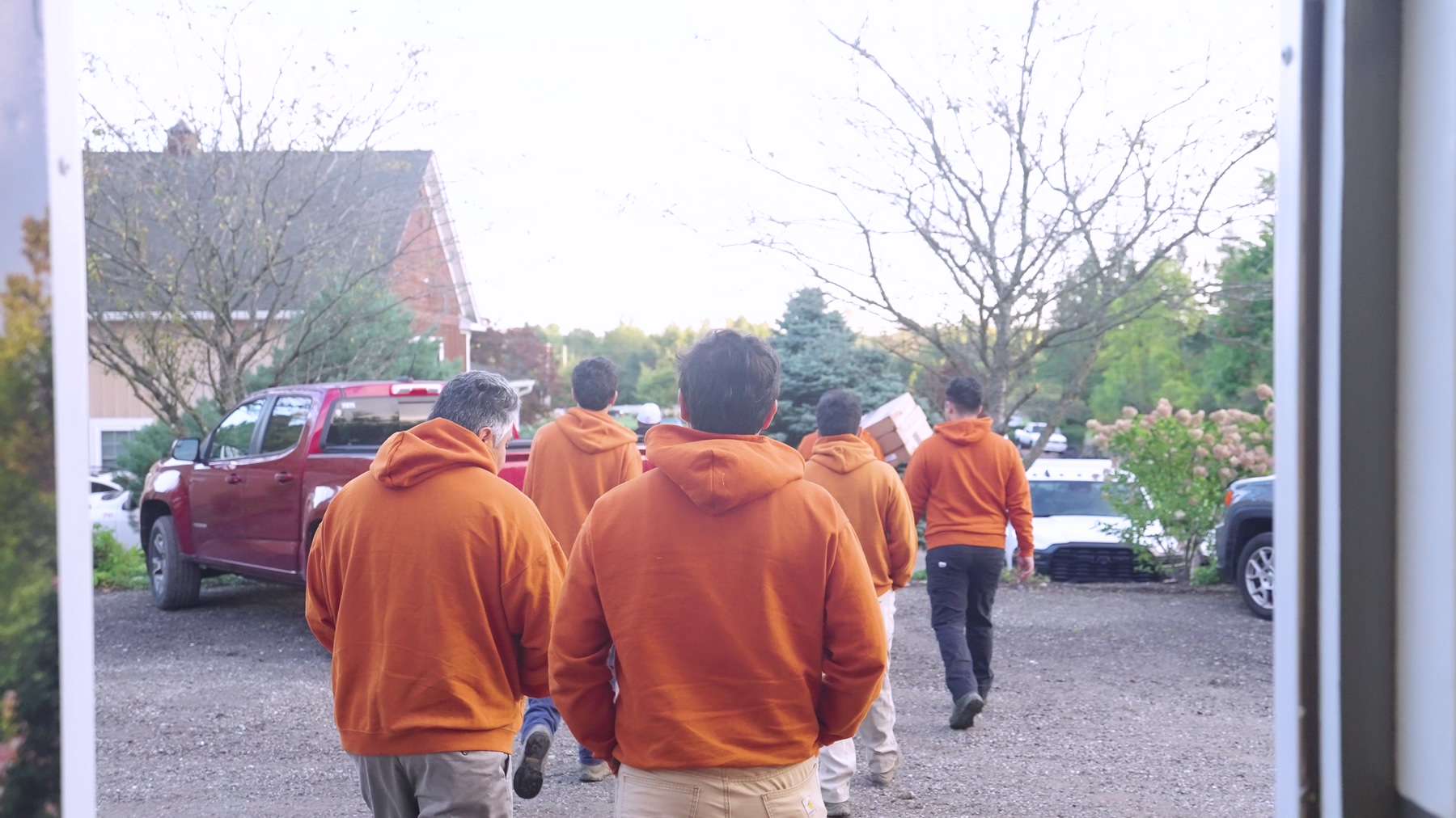 Exscape Group crew members heading out to their trucks at dawn