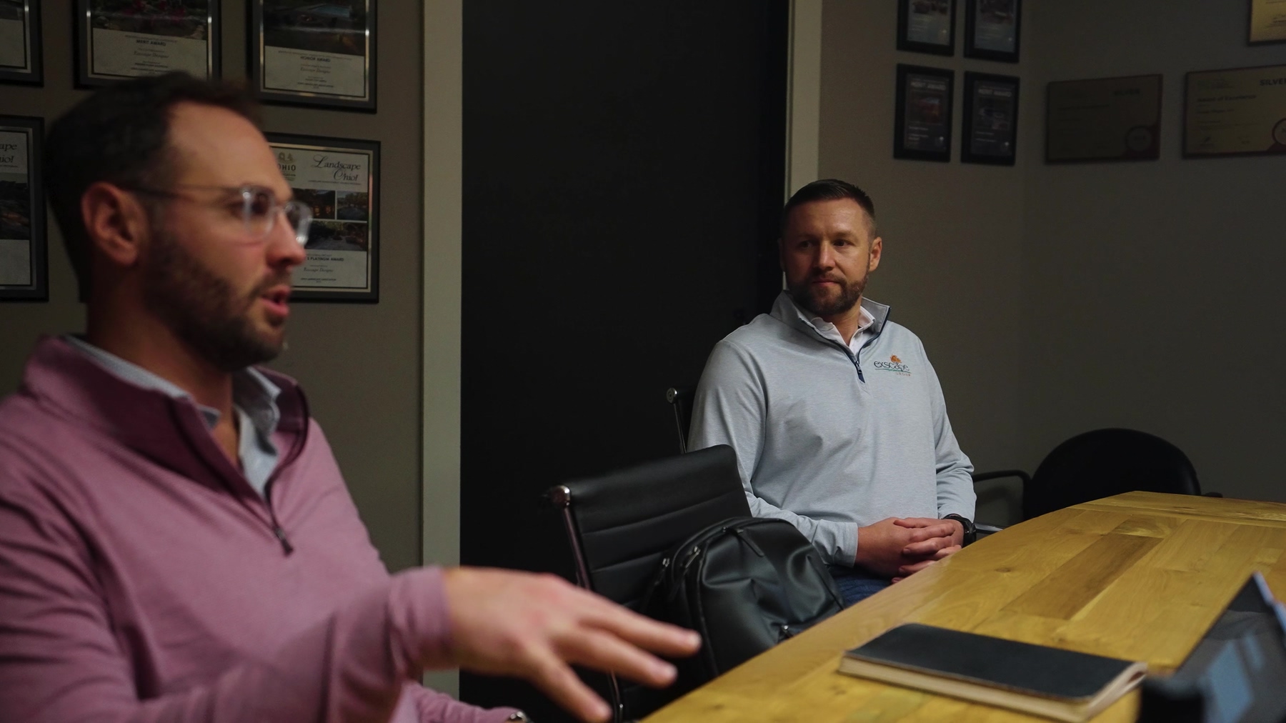 Exscape Group leaders in discussion at the conference table