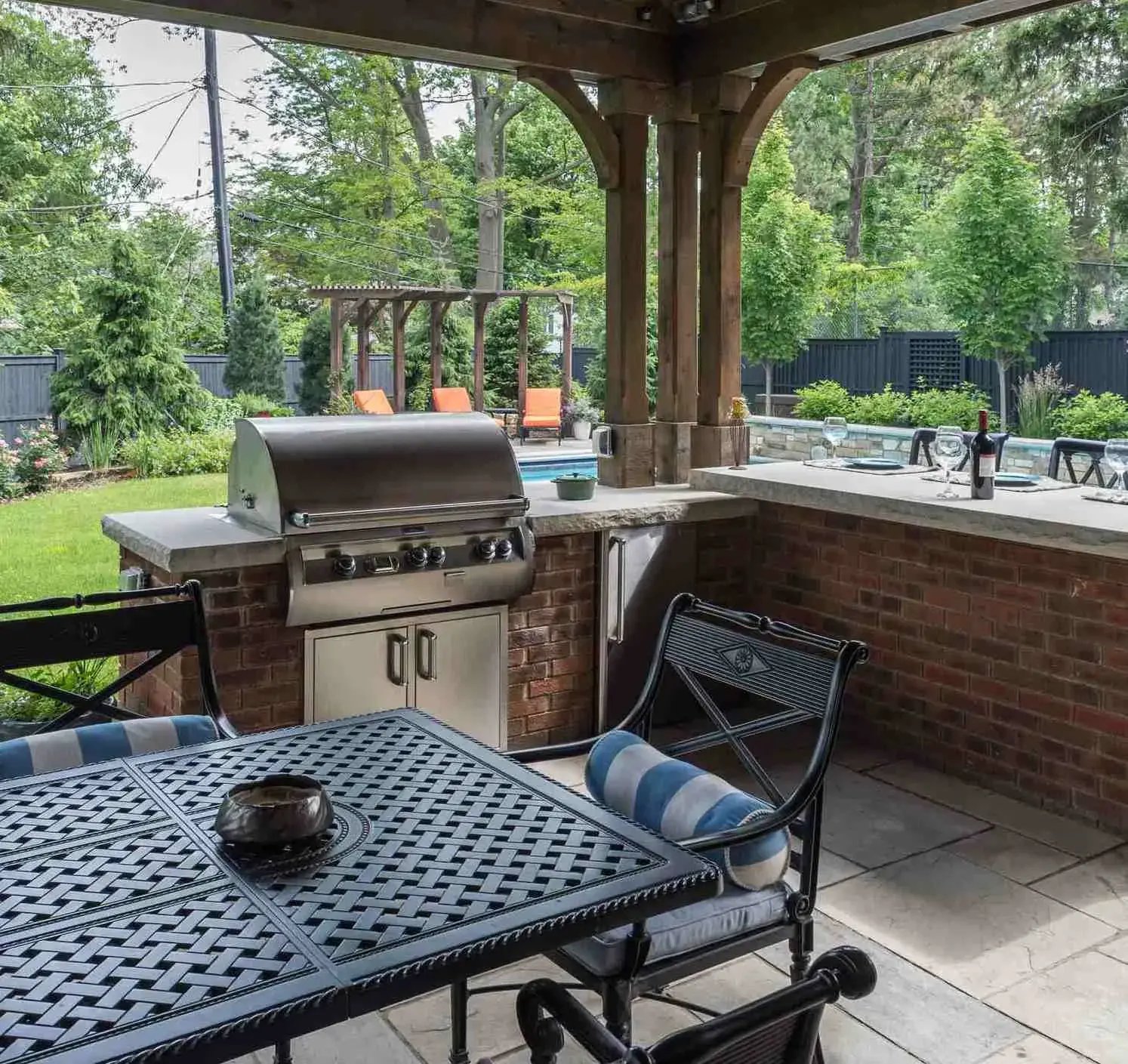 Outdoor kitchen built into a backyard patio