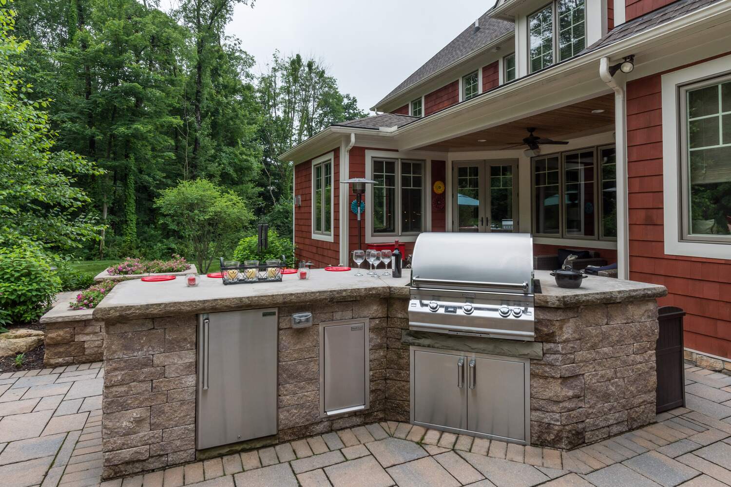 Patio outdoor kitchen with built-in grill and counter seating