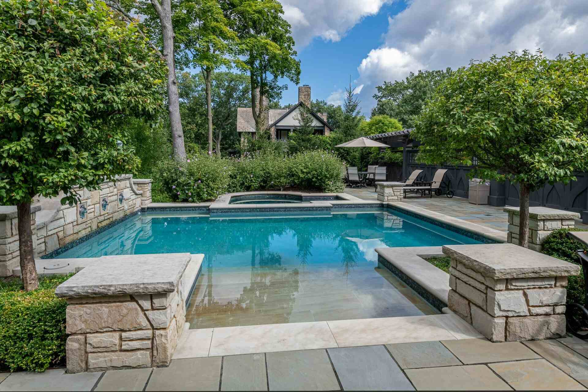 Poolside lounge area with landscaped surround