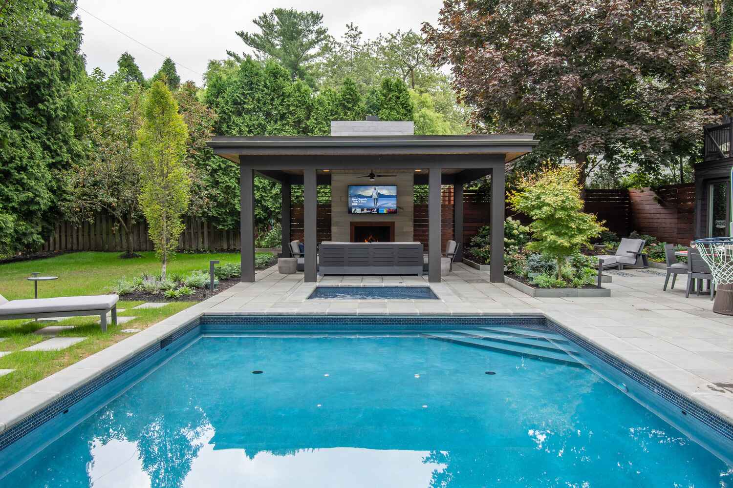 Custom inground pool with surrounding patio and outdoor living space in Ohio