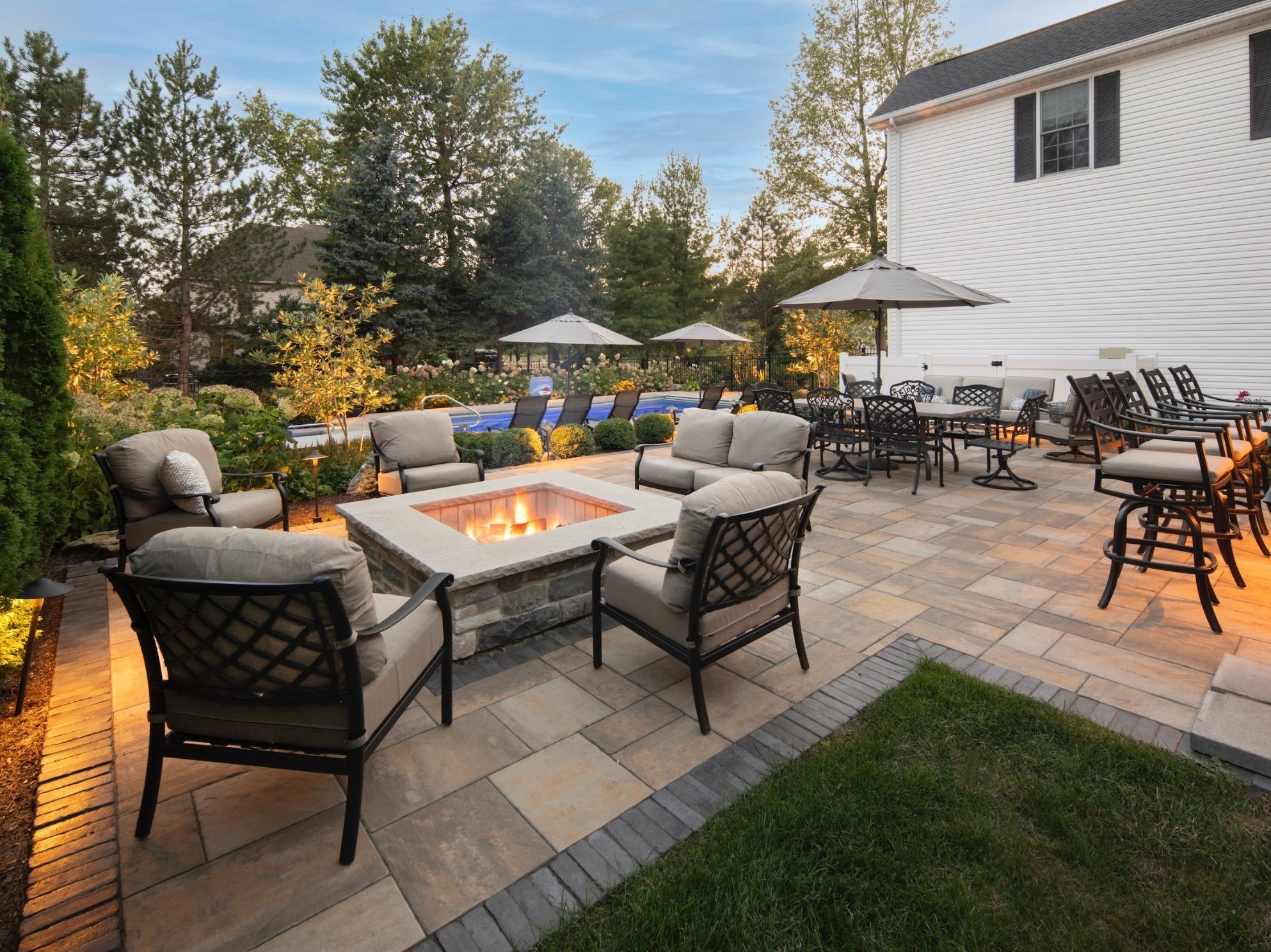 Paver patio with a fire table and outdoor seating