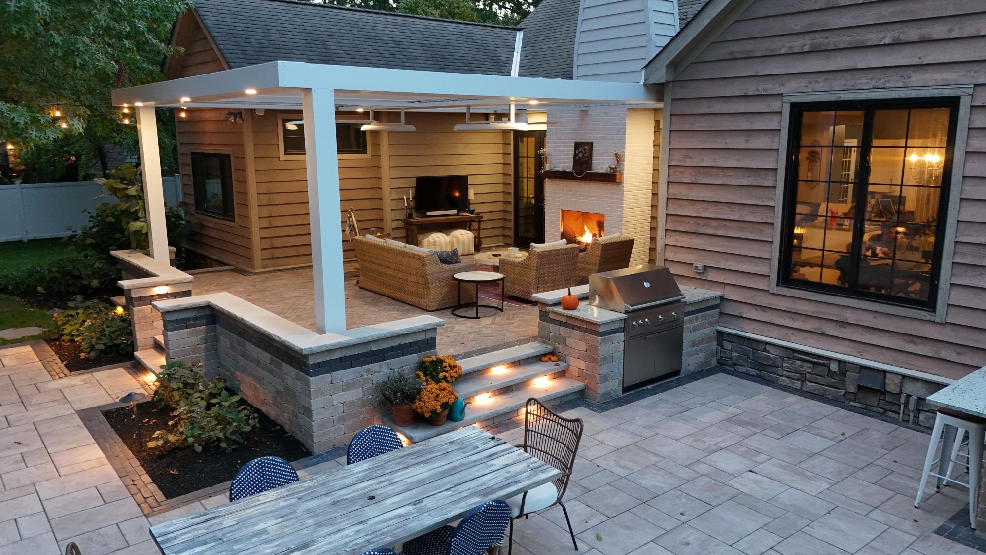 Covered patio with outdoor kitchen and lounge seating