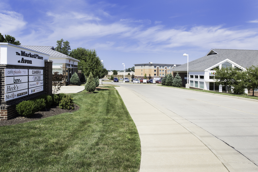 Maintained lawn and walkway at a commercial retail property