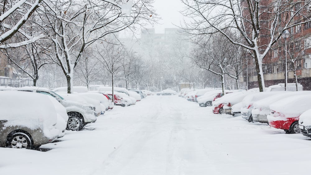 Snow-covered parking lot at a commercial property before clearing Snow-covered parking lot at a commercial property before clearing