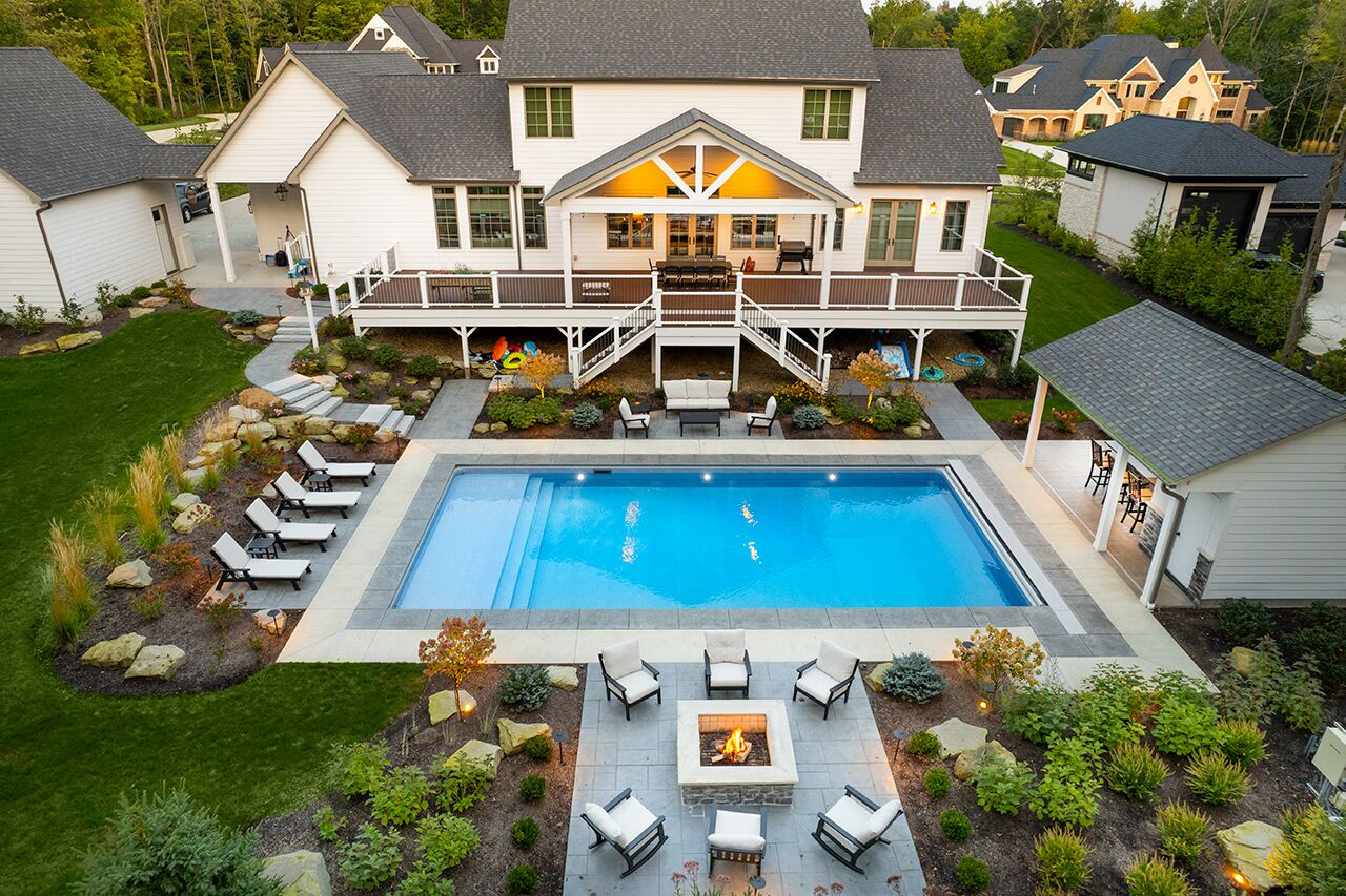 Luxury backyard pool and patio designed with the surrounding landscape