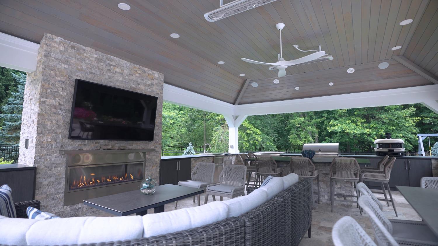 Luxury outdoor living space with privacy fencing and lush plantings in Highland Heights