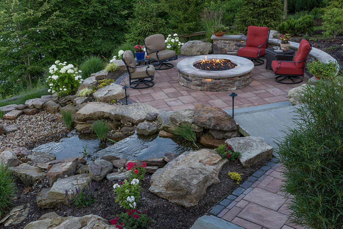 Neatly edged planting beds adding structure and color to a backyard in Gates Mills, OH