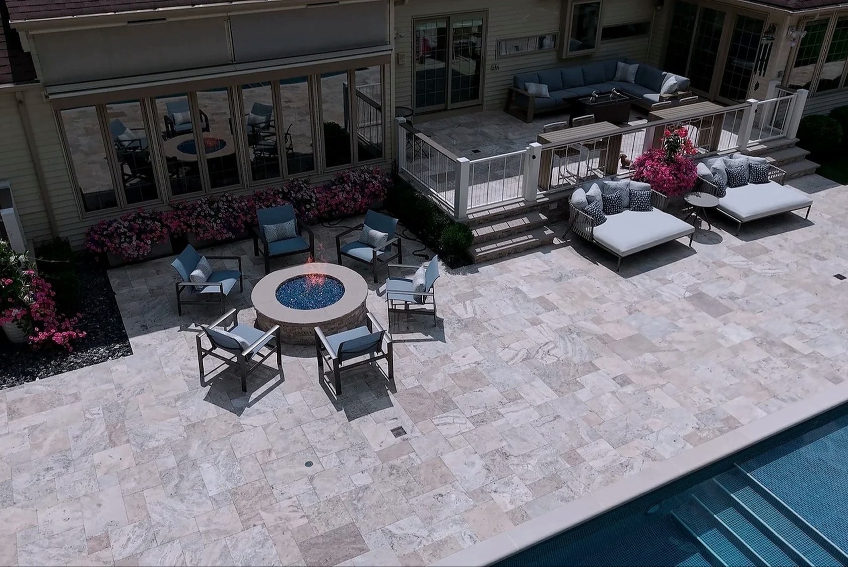 Poolside patio and fire pit by Exscape Group