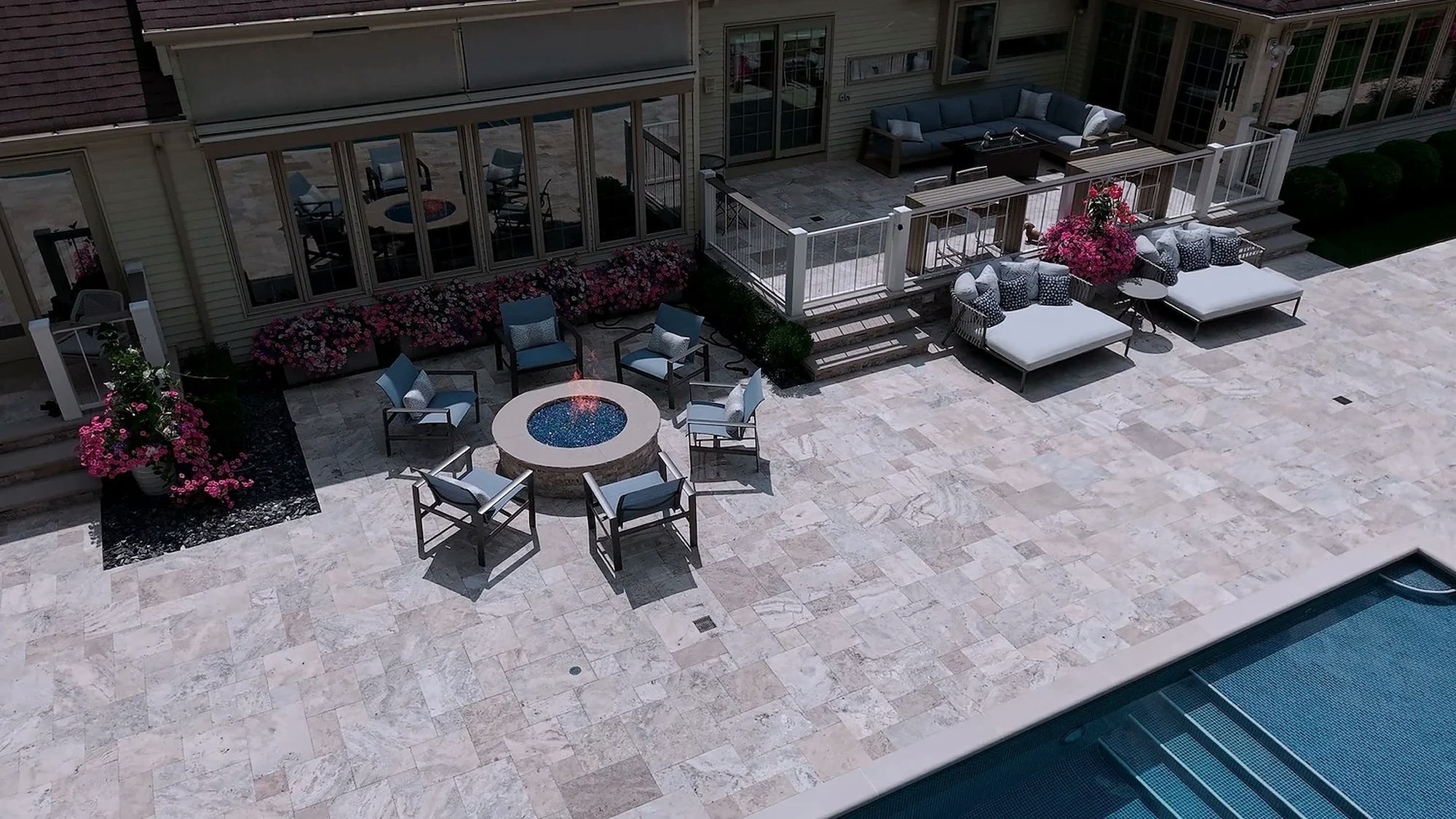 Poolside patio and fire pit by Exscape Group