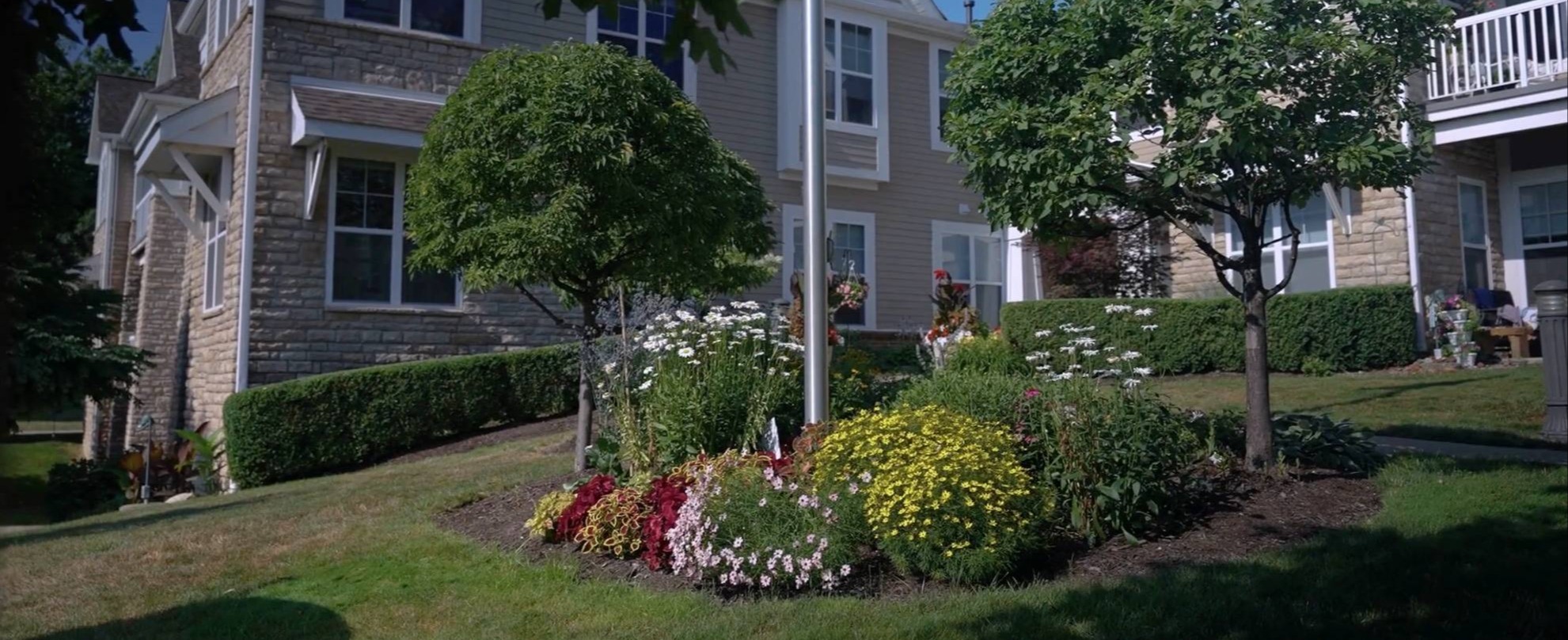 Professional commercial lawn care and landscape beds at an office property