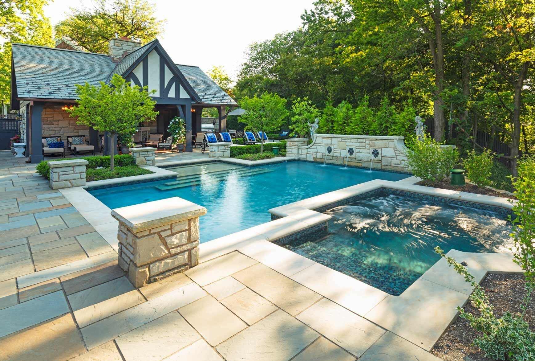 Resort-style pool and spa combination in Gates Mills, OH designed for relaxation