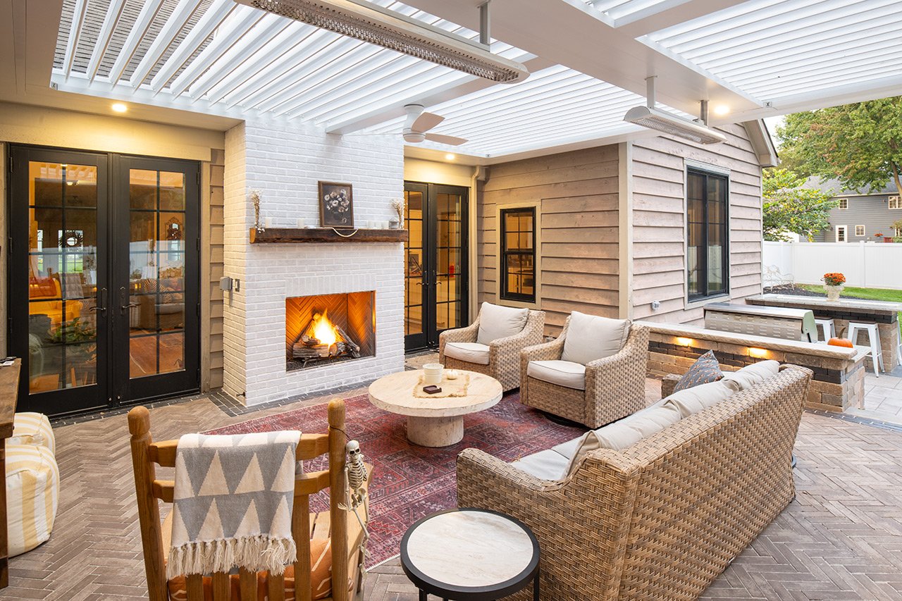Covered patio with outdoor fireplace and lounge seating