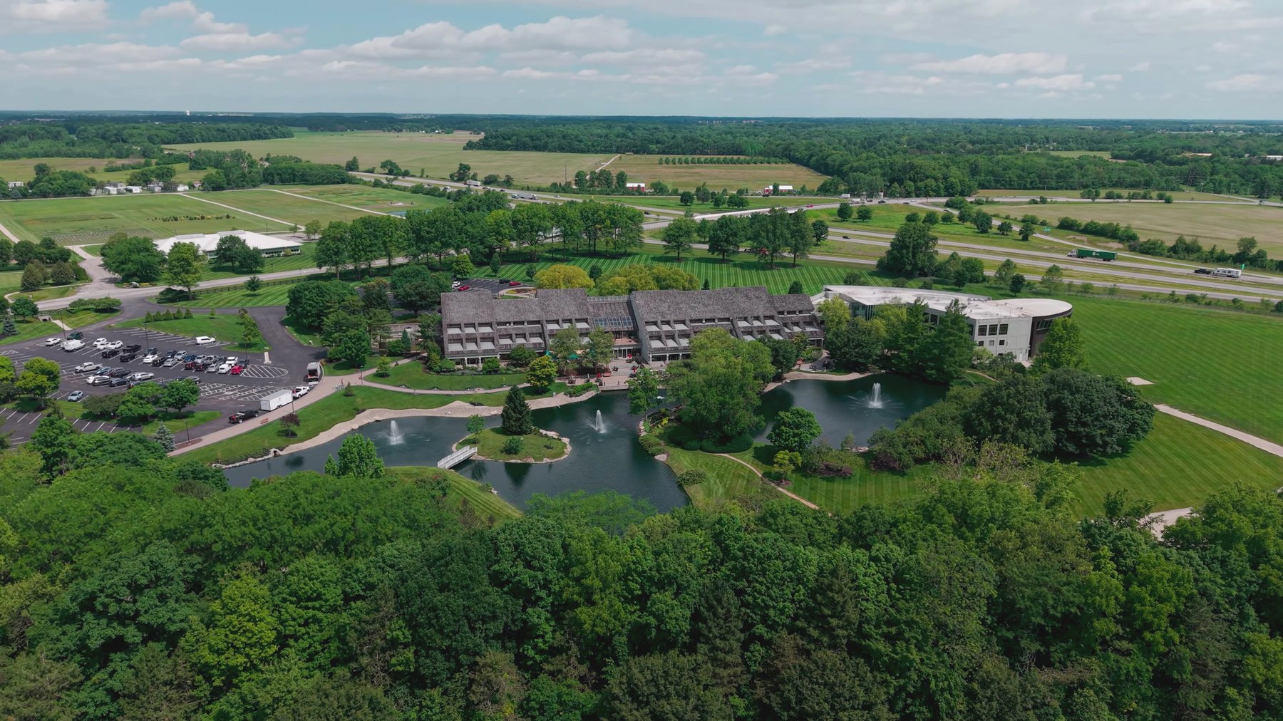Aerial view of a corporate campus with ponds and maintained grounds
