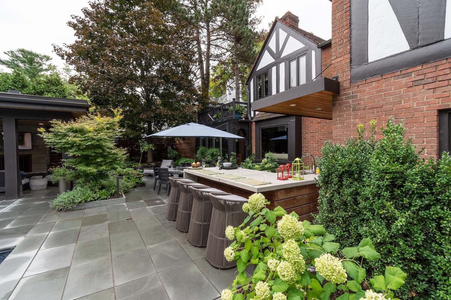 Thoughtfully designed multi-level backyard with pool, pavilion, and garden beds in Beachwood, OH