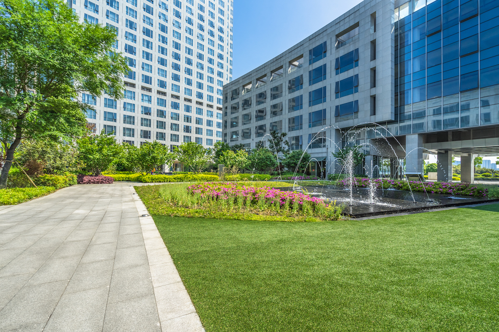 Commercial landscape installation with walkways and planted beds