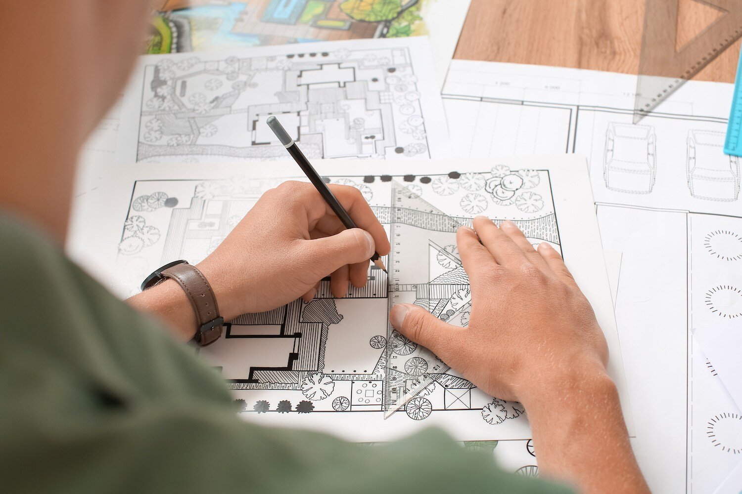 Landscape architect drafting custom outdoor living design plans in Painesville, Ohio by Exscape Group